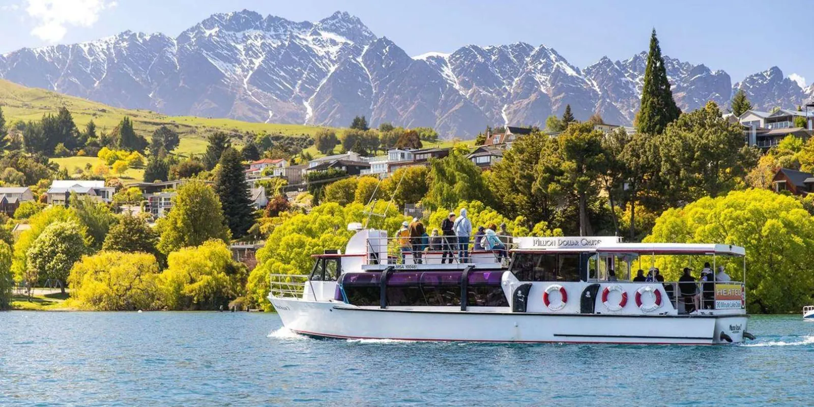 Lake cruise boat at the Queenstown waterfront with the Remarkables beyond